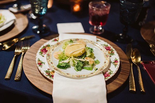 place setting with Southern Caesar Salad on china with a floral pattern