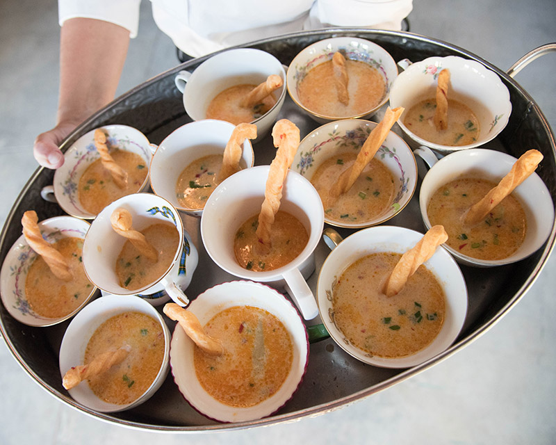 Bowls of She Crab Bisque on a serving platter