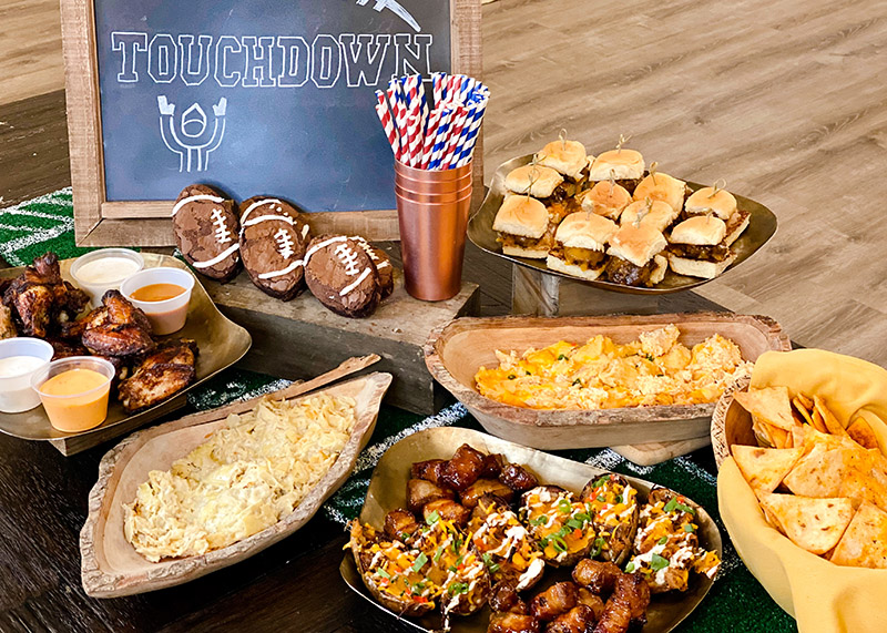 Mouthwatering Super Bowl snacks presented on serving dishes