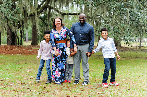 happy family with a mom, dad, and three boys